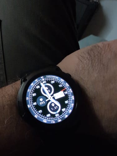 Close-up of a reviewer's Gard Pro Ultra 3 watch on their wrist, showing the detailed, illuminated display.