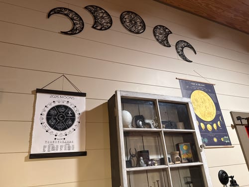 Customer's 2026 Moon Phase Calendar hanging on a wall as part of a decorative moon altar.
