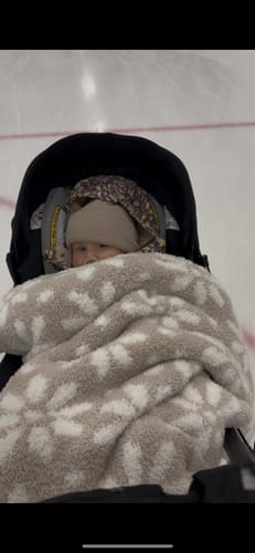 Customer photo review of Blushing Beige and White Daisy Print Toddler Blanket