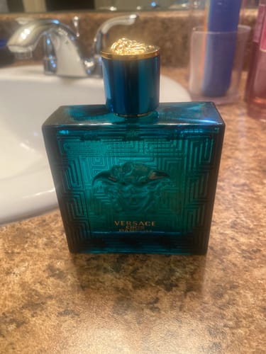Customer's bottle of Versace Eros Eau De Parfum spray on a bathroom counter.