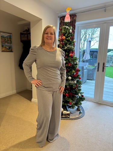 Reviewer wearing a comfortable grey top and wide-leg trousers made from the Plain Lurex Scuba Fabric.