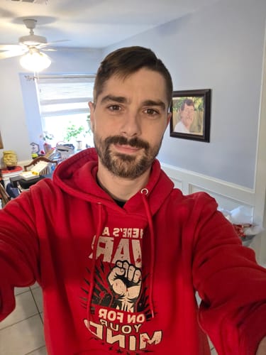 Customer photo review of There's A War On For Your Mind Hoodie