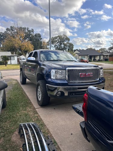 Reviewer's blue truck shown from the front after installing the Upper Control Arms with 3" Front Leveling Lift Kit.