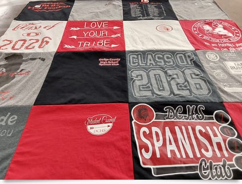 Close-up of a customer's colorful Premium T Shirt Quilt made with patches from high school shirts.
