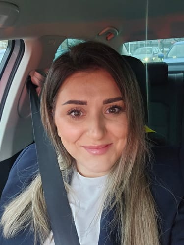 Reviewer in a car showing their smooth, even complexion after applying the BB Cream SPF30.