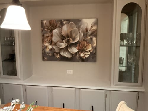 Customer's oversized blossom wall art hanging as a focal point in their dining room.