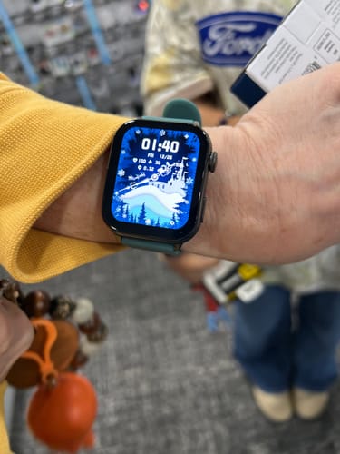 Customer's wrist showing the Gard Pro Health Smartwatch 3 with a custom winter photo on the watch face.