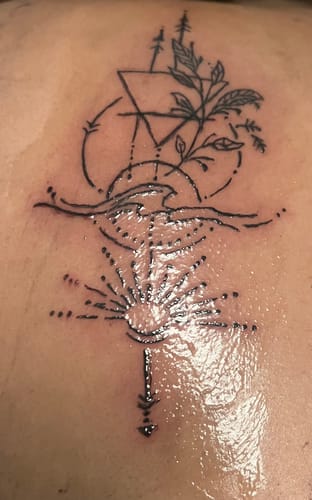 Customer's fresh tattoo, with calm surrounding skin after using Painless Tattoo Numbing Cream.