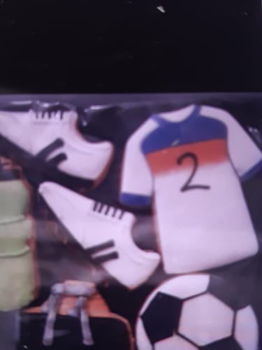 Close-up: Customer's Football Biscuit Box with a shirt biscuit showing the number 2, boots, a ball, and a water bottle.