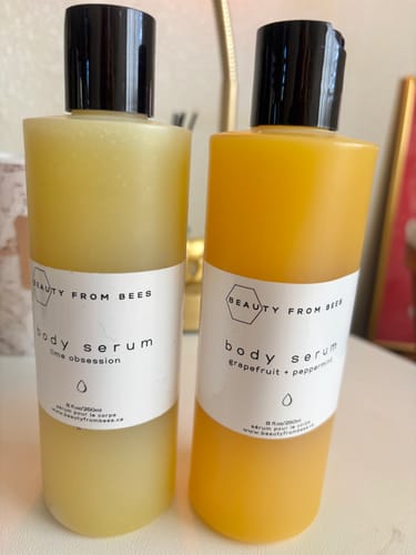 Customer's two bottles of Body Serum, showing the 'lime obsession' and 'grapefruit + peppermint' scents side-by-side.
