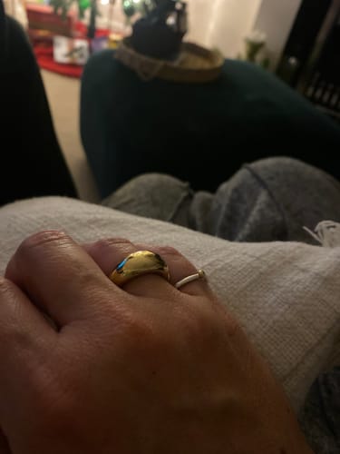 Reviewer's hand wearing the chunky gold Chunky Dome Ring.