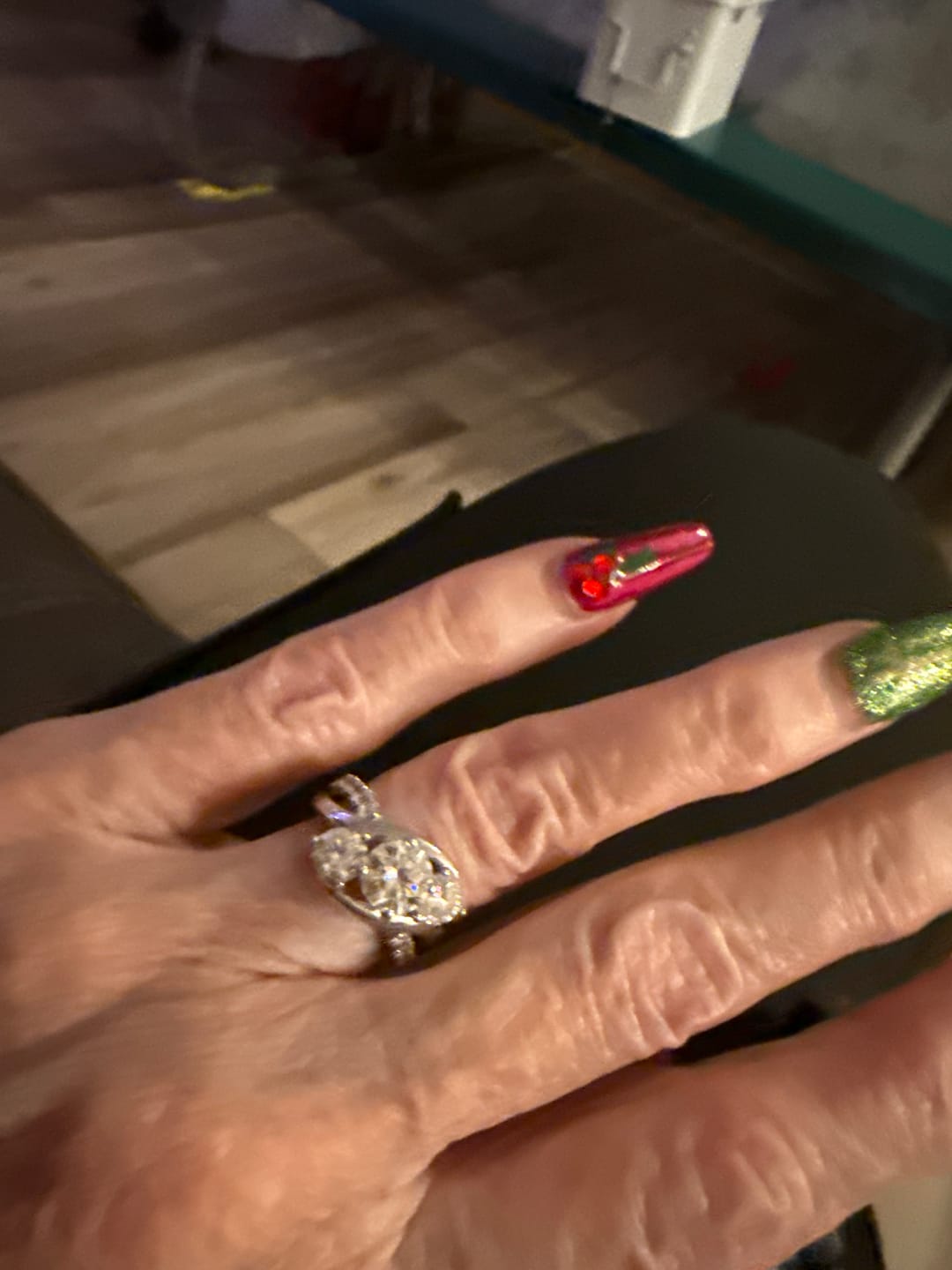 Customer photo review of Swirl Three Stone Moissanite Twisted Pave Engagement Ring