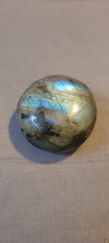 Customer's polished labradorite crystal from their monthly subscription, showing blue iridescence.
