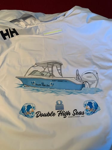 Customer's white Helly Hansen jacket showing the back with a large, custom boat logo that says 'Double High Seas'.