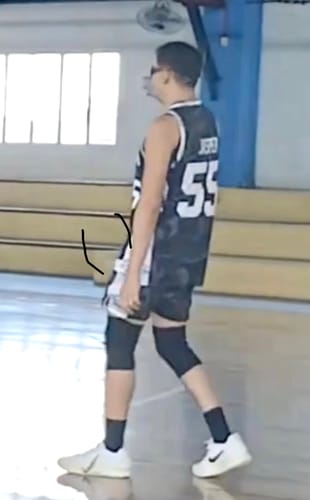 Reviewer on a basketball court wearing the white Nike JA 3 'Light Show' EP Basketball Shoes.