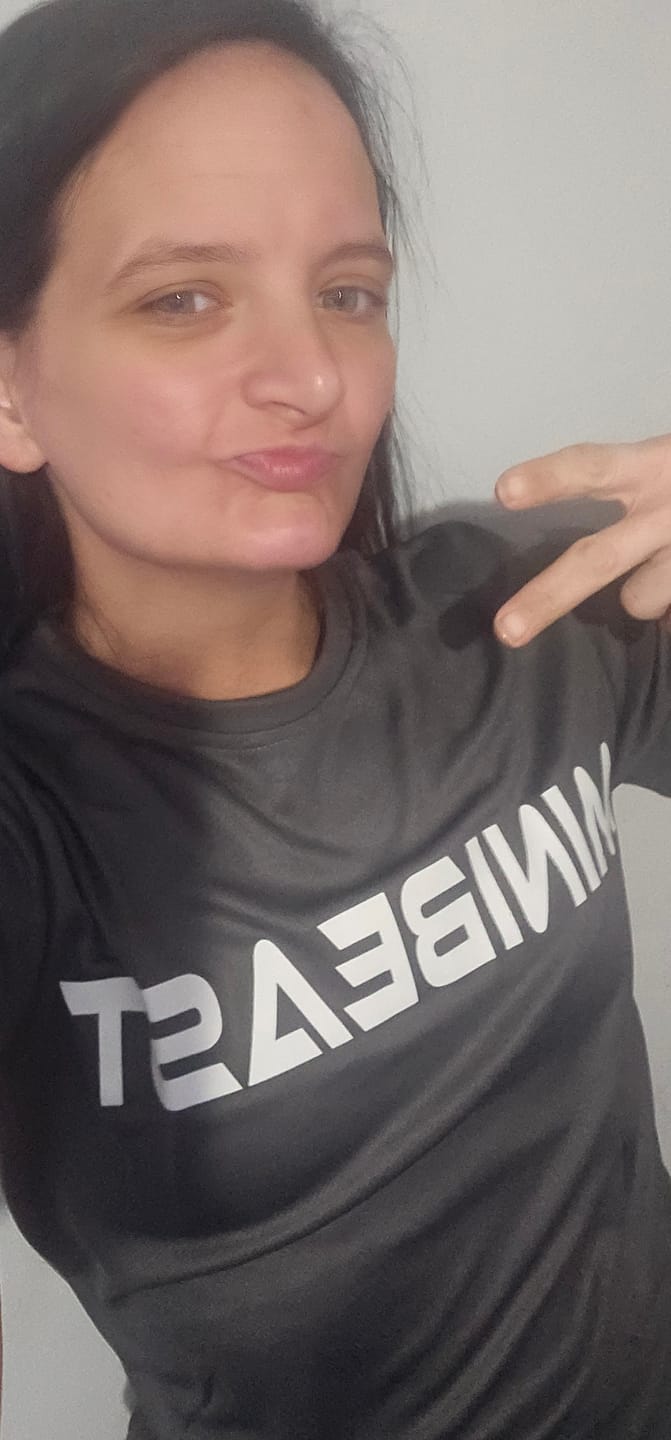 Customer photo review of "Girls Who Lift" Performance Unisex Tee