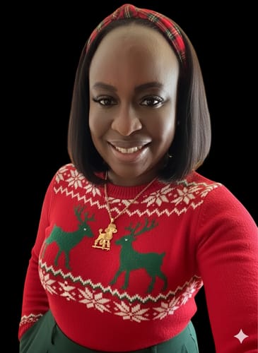 Reviewer wearing a gold custom logo pendant necklace shaped like a poodle with a festive sweater.