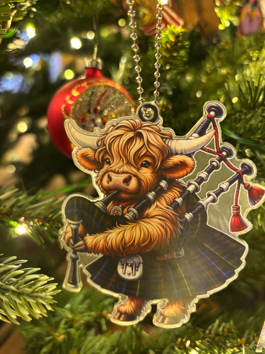 Customer photo review of Scottish Smith Modern Clan Tartan Ornament Highland Cow Playing Bagpipes