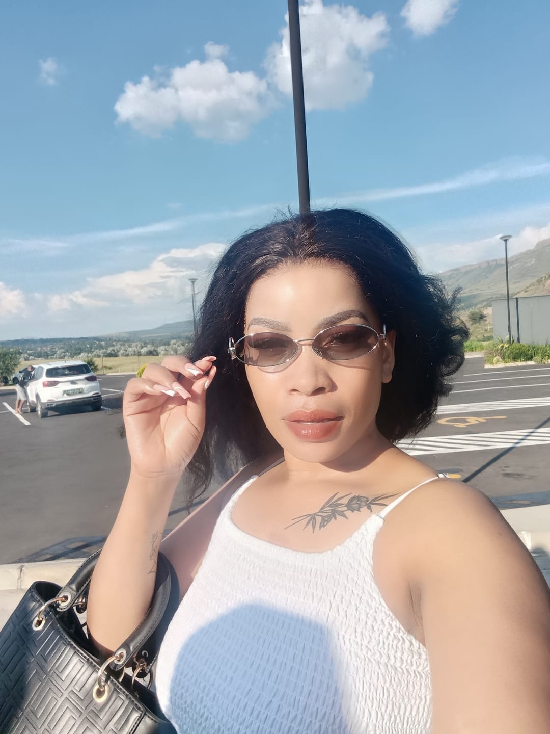 Customer photo review of Muse Logo Sunglasses – Silver Edition
