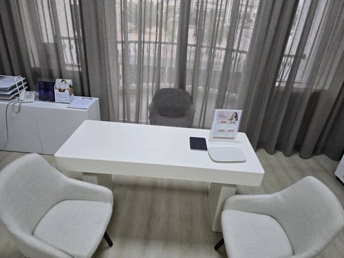 Customer's two off-white Office Chair Tub-4SM-W-HF chairs arranged in a modern office setting.