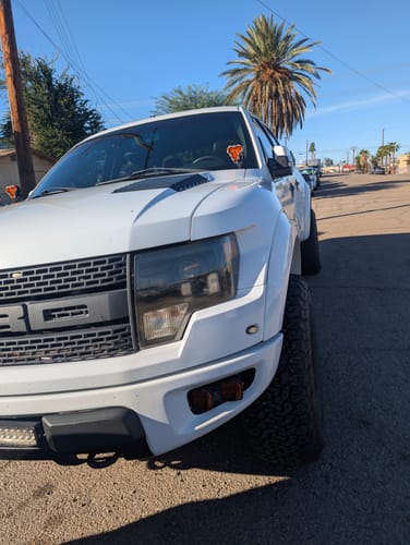 Customer's white Ford truck with Hubcentric Wheel Spacers installed, showing the resulting wider wheel stance.