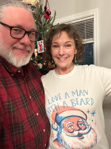 Reviewer wearing the white 'I Love a Man With a Beard' tee, posing with a man who has a beard.