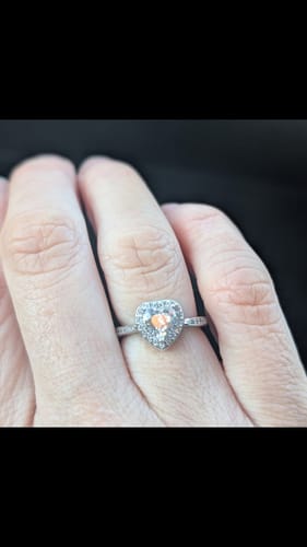 Close-up of a reviewer's hand wearing the heart-shaped Forever In My Heart Urn Ring.