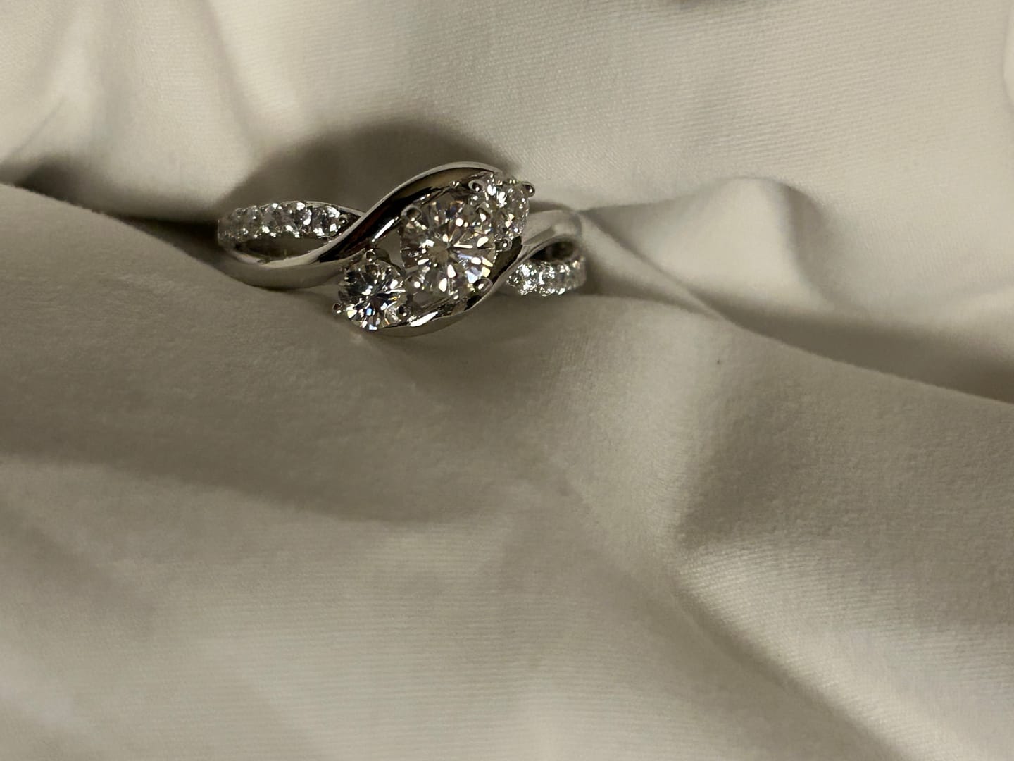 Customer photo review of Swirl Three Stone Moissanite Twisted Pave Engagement Ring