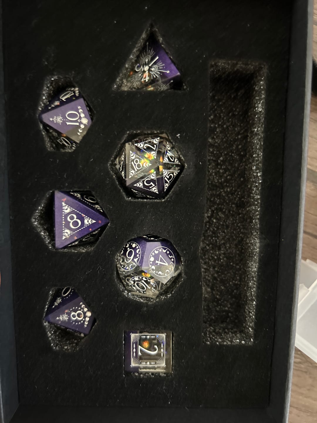 Customer photo review of URWizards D&D The Galaxy Resin Engraved Dice Set Astrology Style