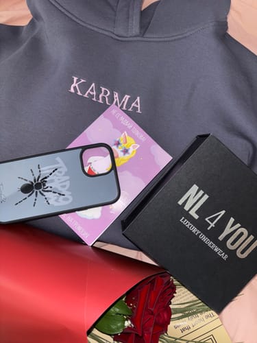 A customer's black NL4YOU box containing their Red & Black underwear, among other items.