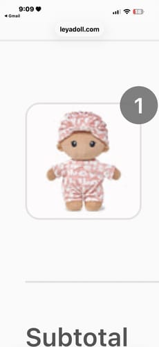 Customer's screenshot of the Pudding Baby Girl doll on the product page, wearing a pink patterned outfit.