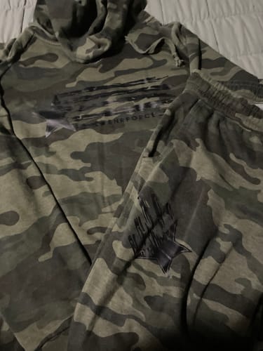 Customer's Ladies Rugged Bundle, featuring a camouflage hoodie and matching pants with black graphics.