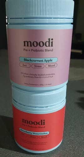 Customer's tub of Blackcurrant Apple moodi blend stacked on top of a tub of the Strawberry Watermelon flavor.