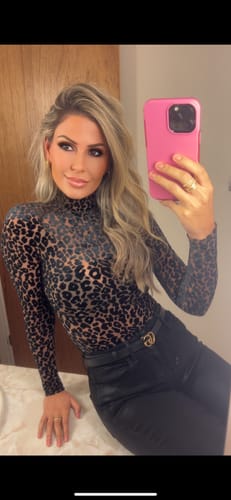 Reviewer showing the fit of the Burnout Print Turtleneck Bodysuit in a mirror selfie.