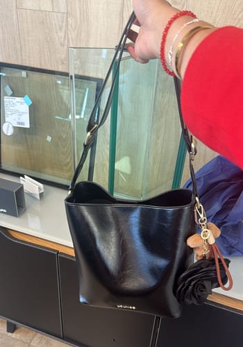 Reseña con foto de un cliente sobre Cartera Bandolera Éclat