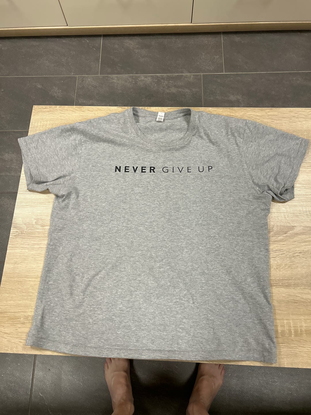 Customer photo review of Never Give Up T-shirt
