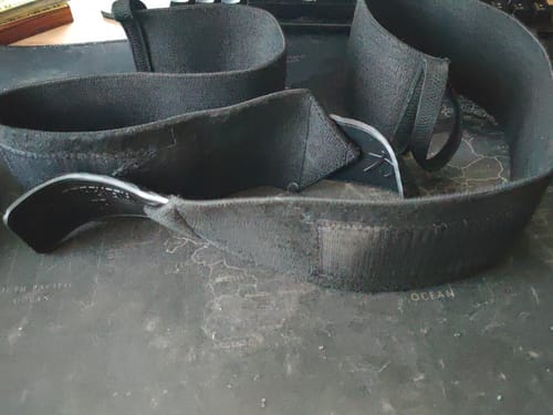 Customer's black Super Heavy Wrist Wraps unrolled on a surface, showing the fabric and velcro after use.