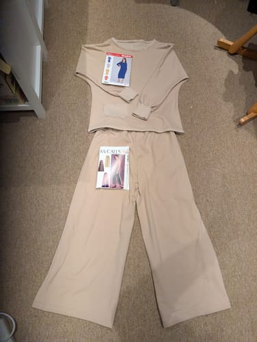 Reviewer's handmade beige top and wide-leg trousers made from the Twill Look Brushed Soft Knit Fabric, laid out on the floor.