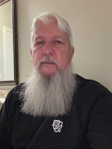 Reviewer in a black t-shirt from Shield Republic, showing the small logo on the chest.