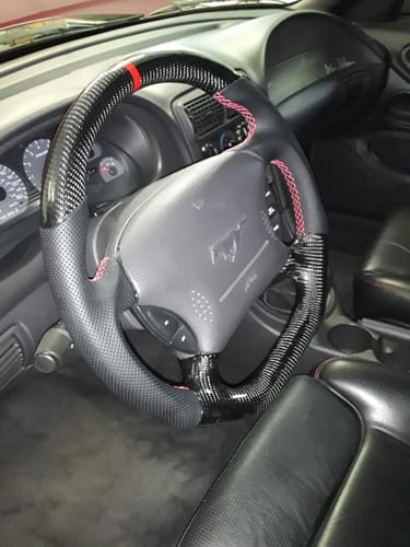 Customer photo review of Carbon Fiber Flat Bottom Steering Wheel for 1994-2004 Ford Mustang SN95 & New Edge | Red Top Stripe, Black Perforated Leather, Red Stitching
