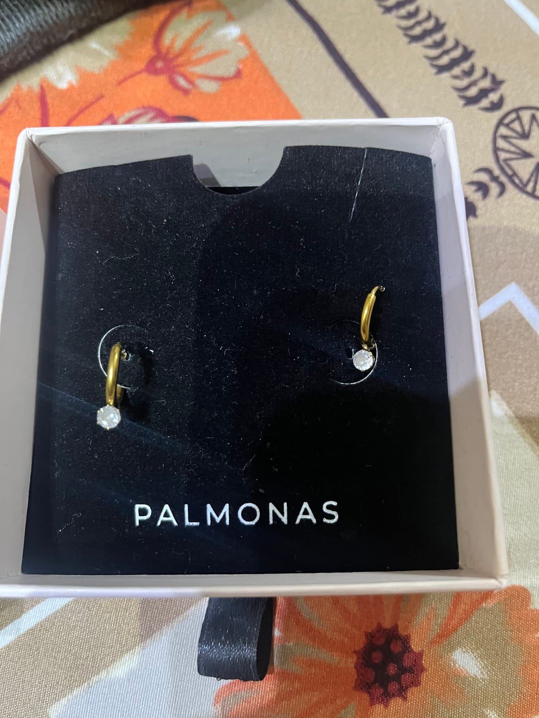 Customer photo review of Tiny Iris Star Hoop Earrings