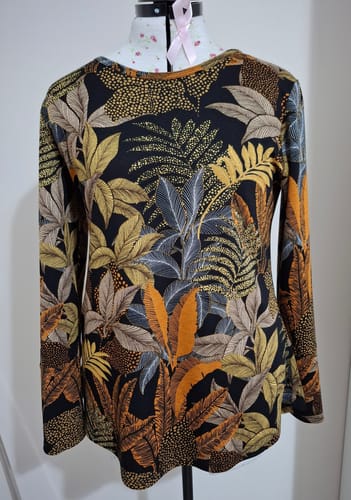 Customer's long-sleeved top sewn from the Autumn Bouquet Jersey Fabric, shown on a mannequin.
