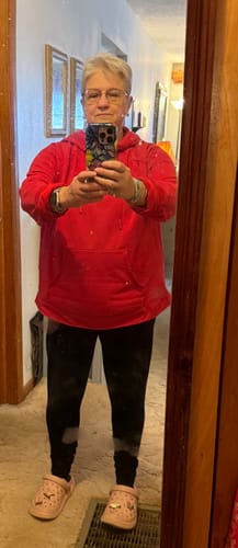 Reviewer shows the fit of the black Stella Petite leggings in a full-length mirror photo.