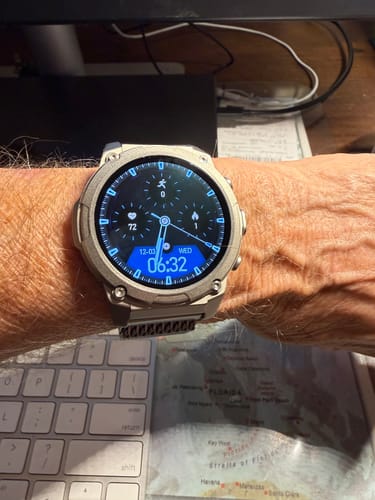 Customer's silver Ultra 3 smartwatch on their wrist with the digital watch face illuminated.