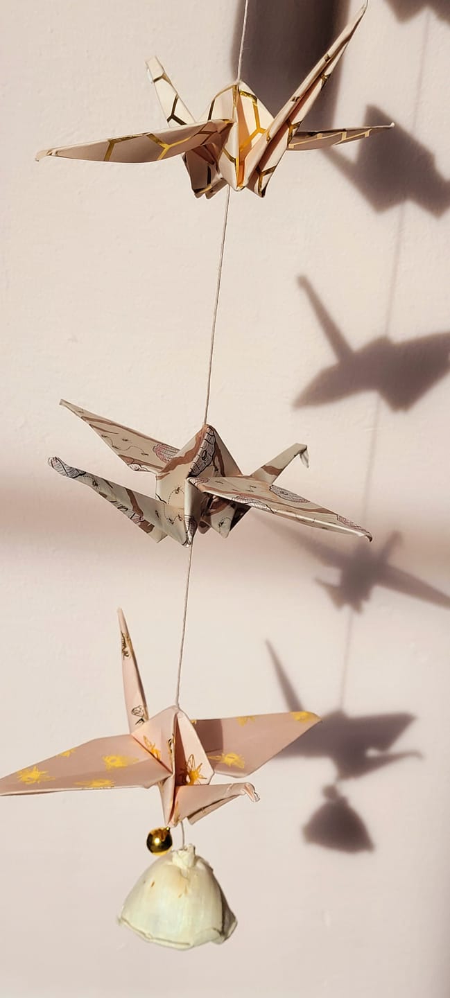 Customer photo review of “Gold Bee” Origami Nursery Mobile
