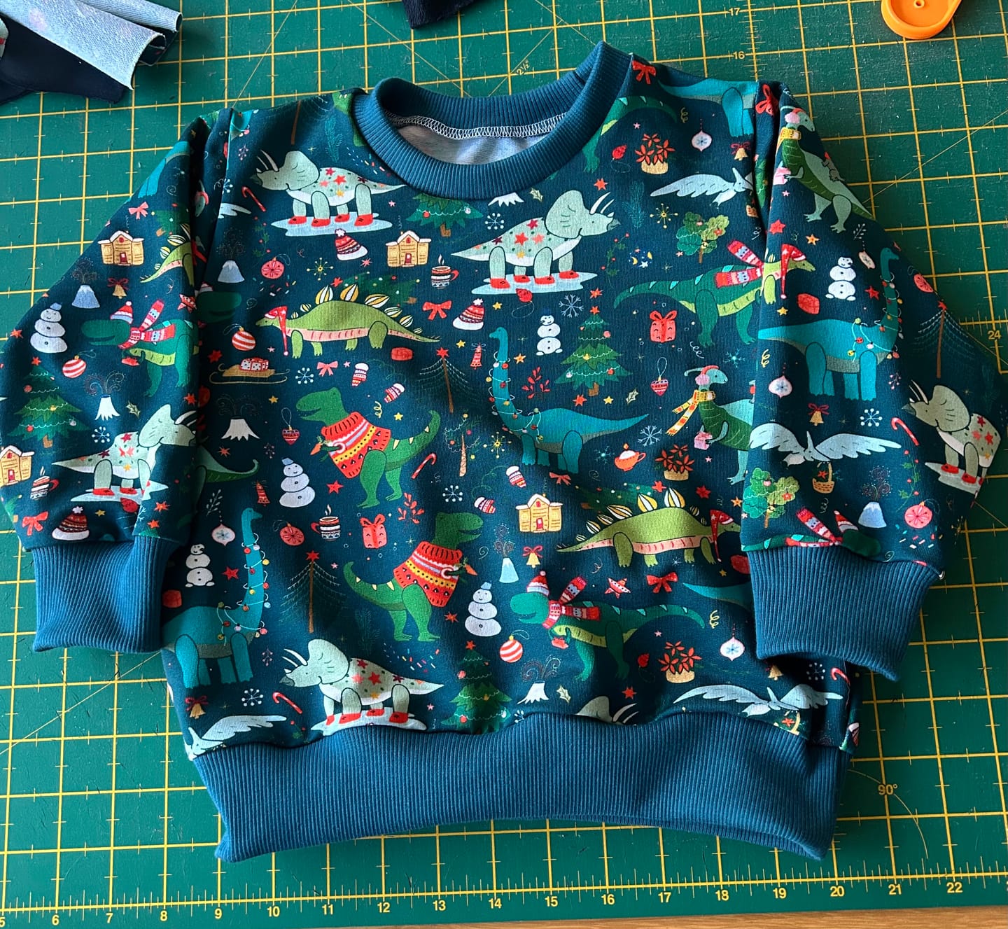Customer photo review of Christmas Dinosaurs on Dark Teal French Terry Fabric