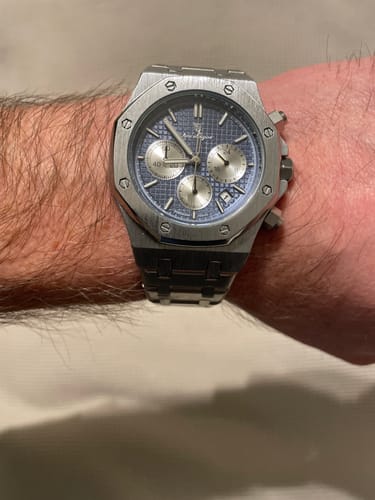 Reviewer wearing the Lucky Fours Tourbillon watch with a textured blue dial on their wrist.