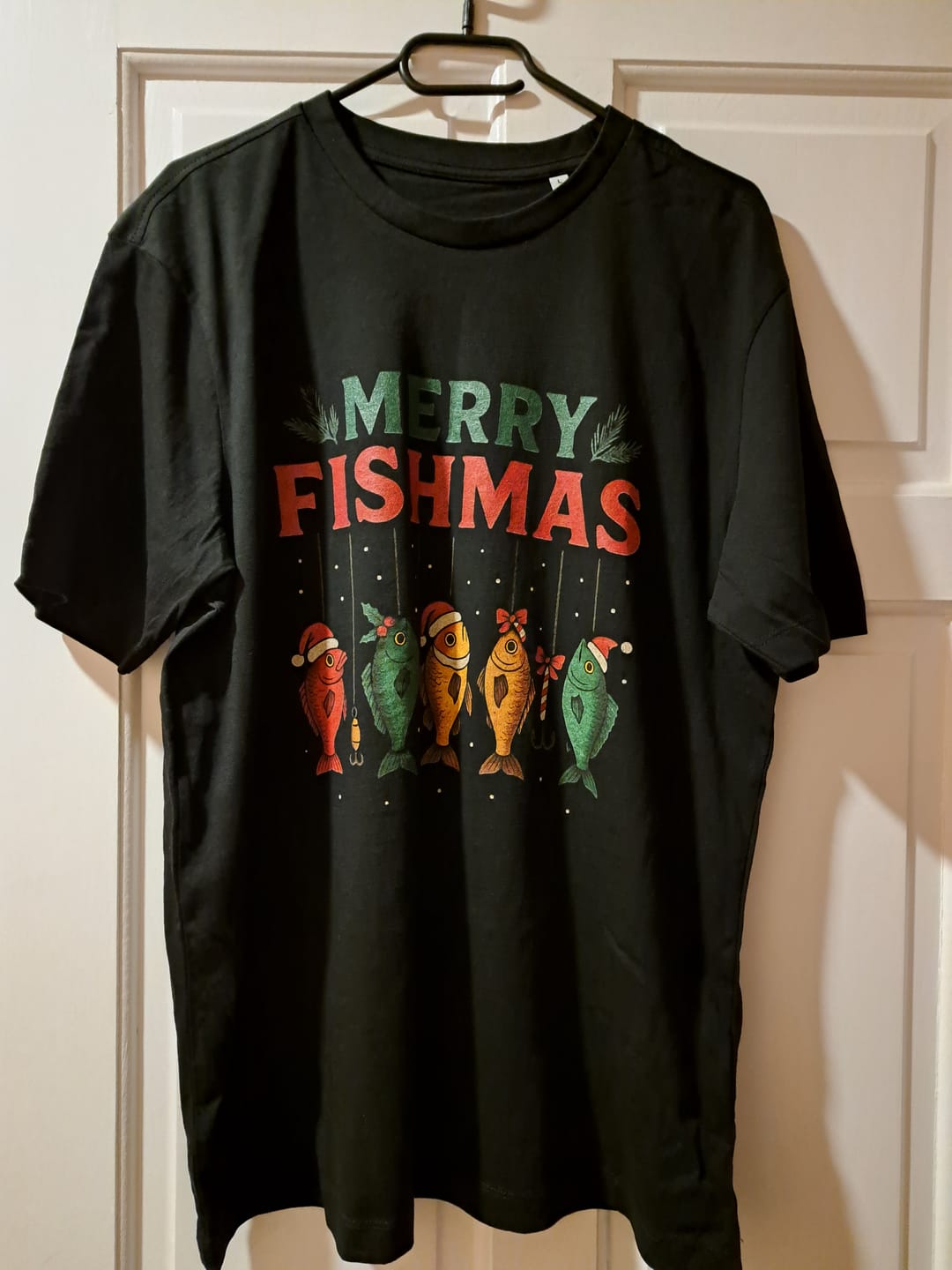Customer photo review of merry fishmas hooked T Shirt
