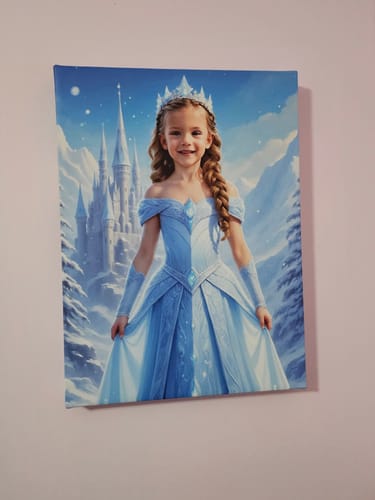 Customer's personalized Ice Princess canvas portrait of a smiling child in a blue gown.