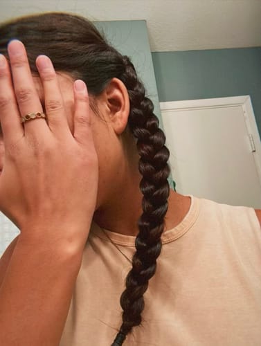 A customer wearing the Gold & Crystal Honeycomb Ring on their finger.